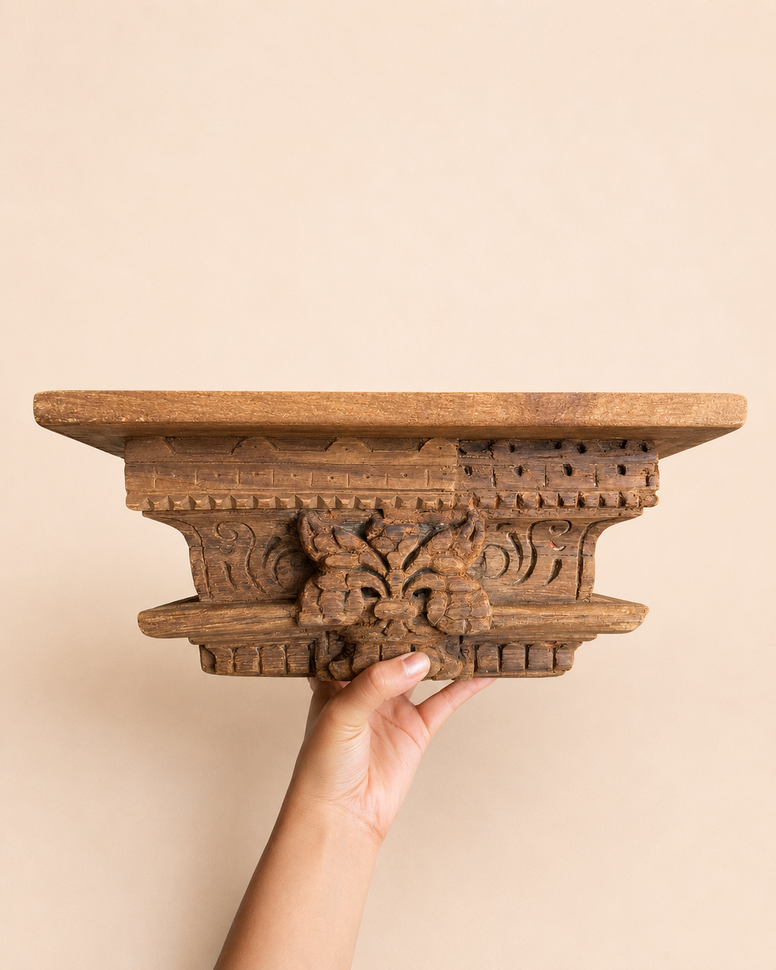 carved wooden shelf