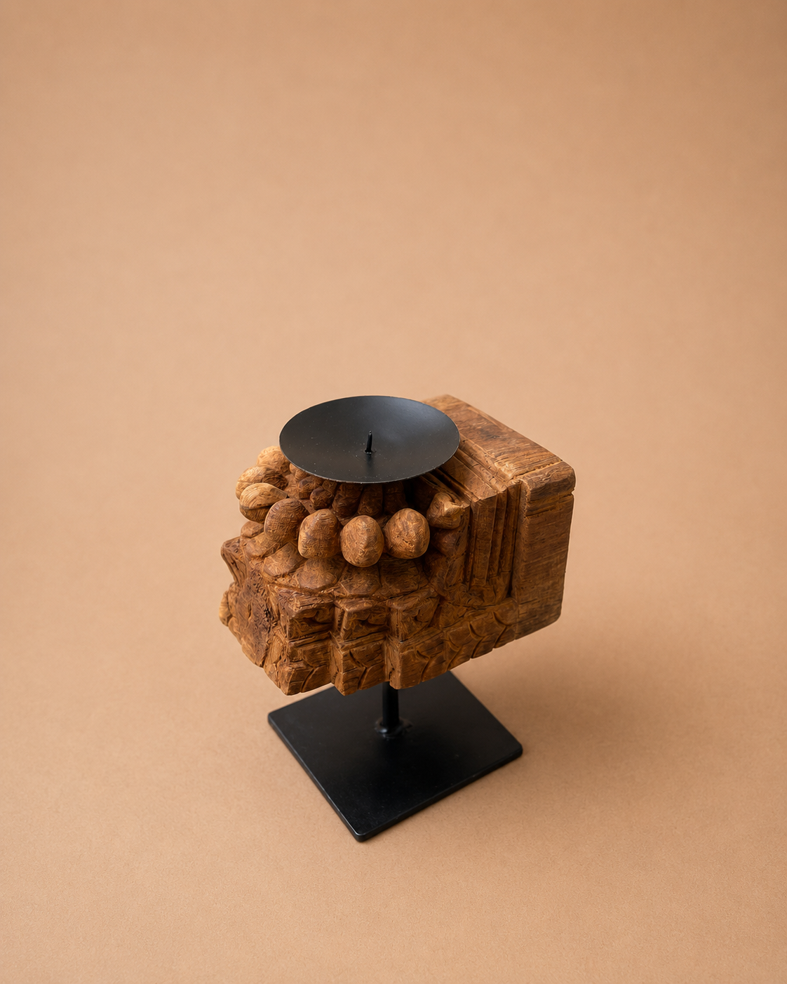 vintage wooden candle holder on iron stand