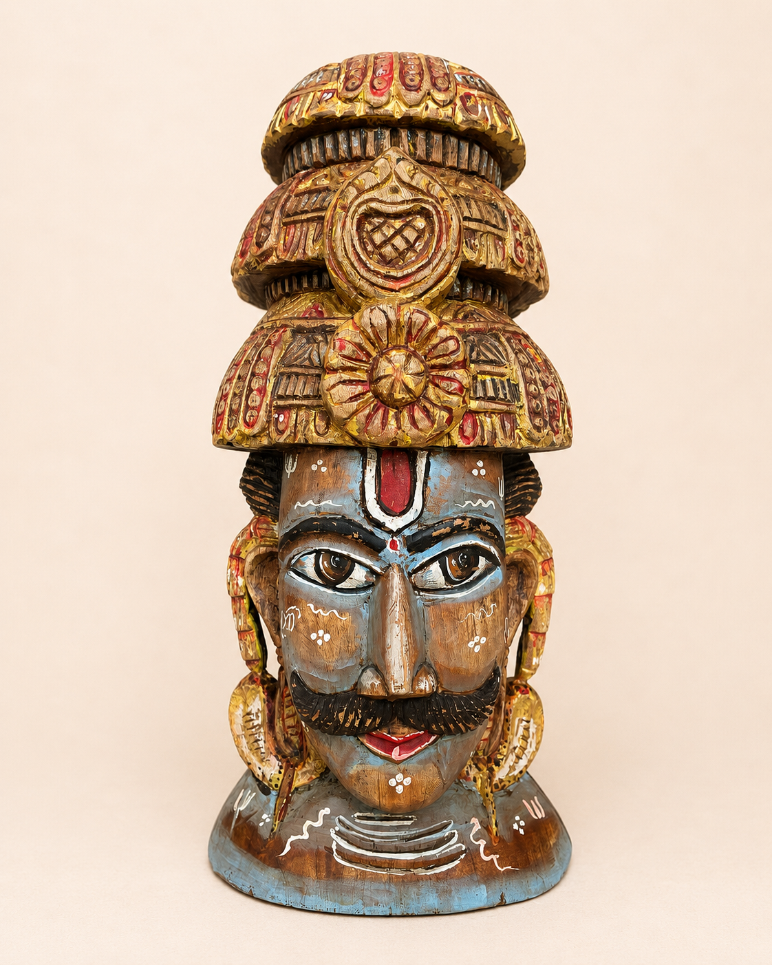 shiva inspired hand-painted wooden face sculpture