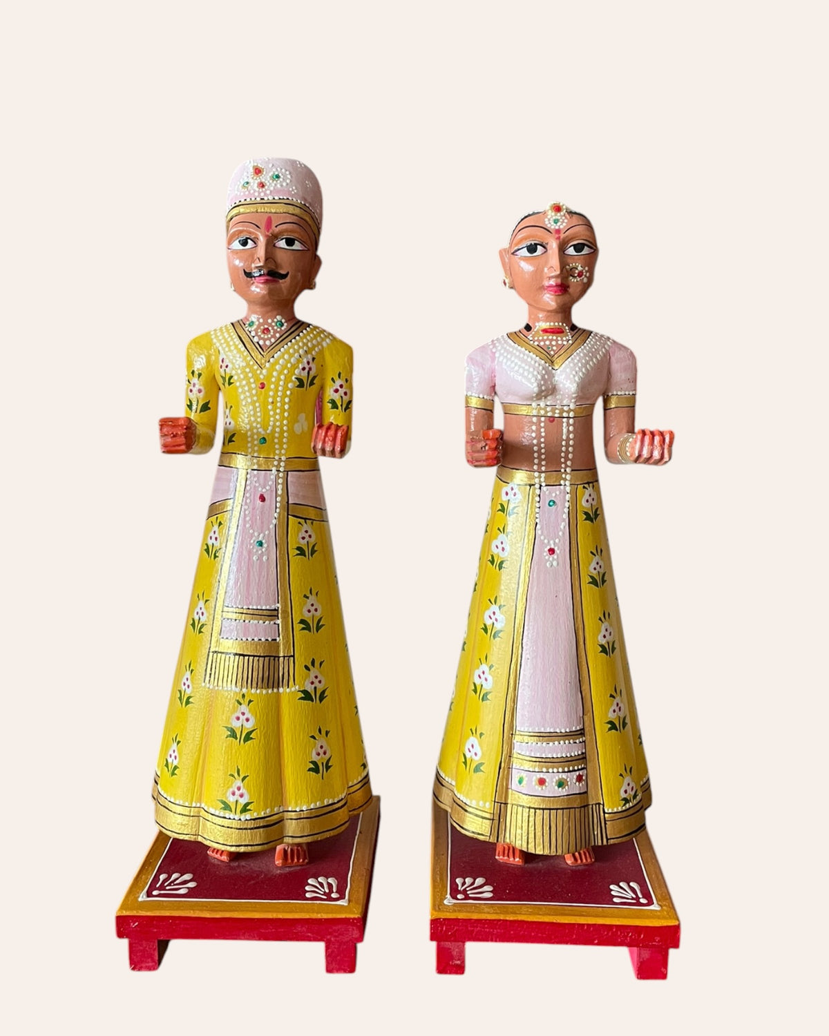 rajasthani heritage yellow hand-painted teak wood isar & gangaur figurines – set of 2