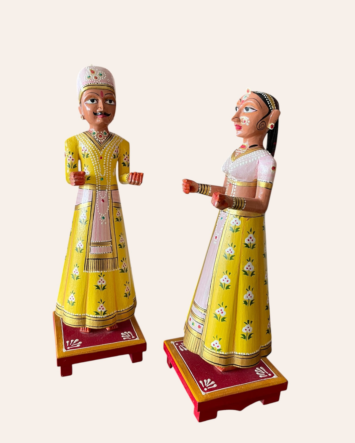 rajasthani heritage yellow hand-painted teak wood isar & gangaur figurines – set of 2
