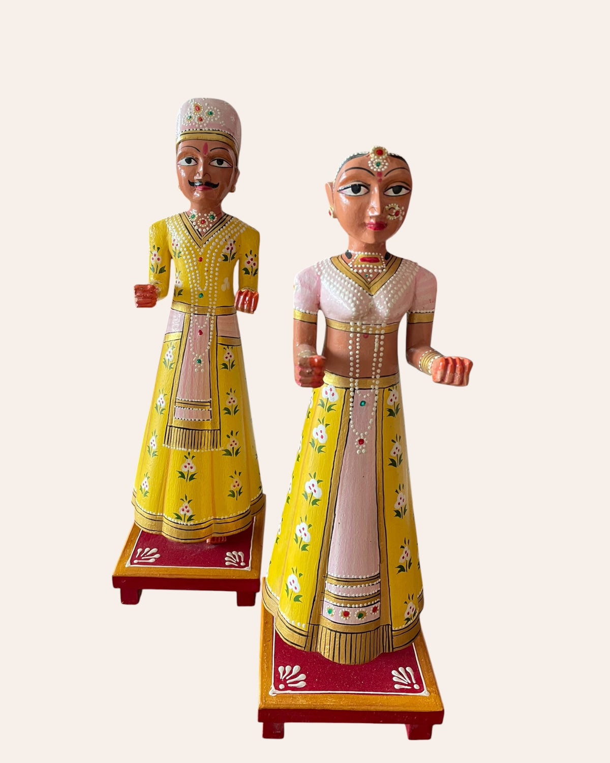 rajasthani heritage yellow hand-painted teak wood isar & gangaur figurines – set of 2