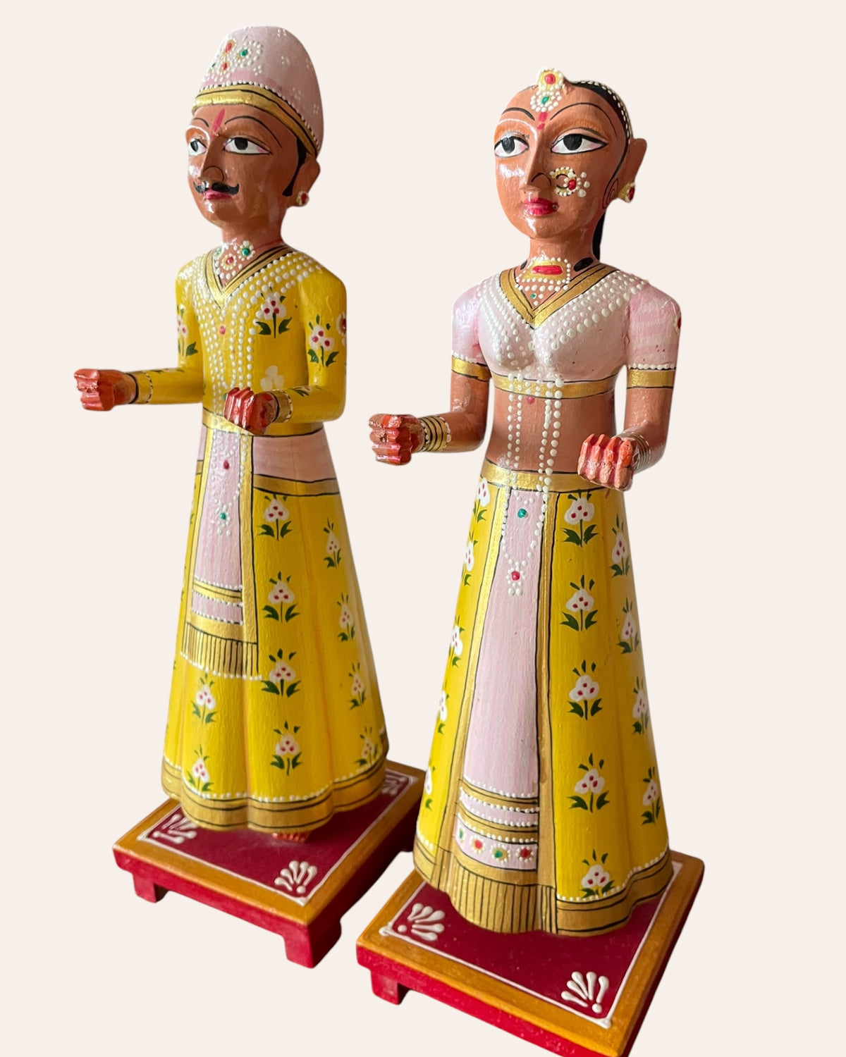 rajasthani heritage yellow hand-painted teak wood isar & gangaur figurines – set of 2