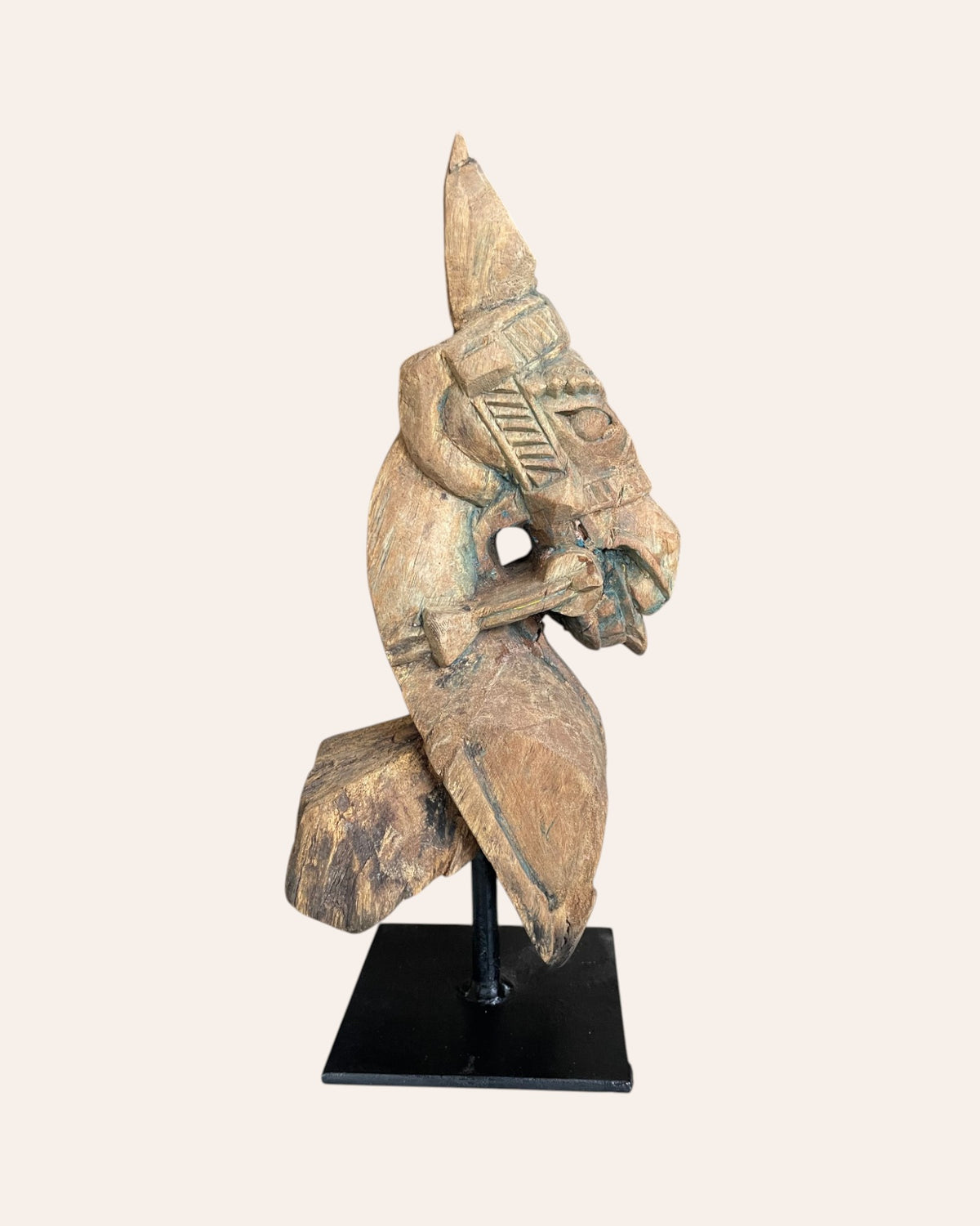hand-carved wooden horse bracket on iron stand