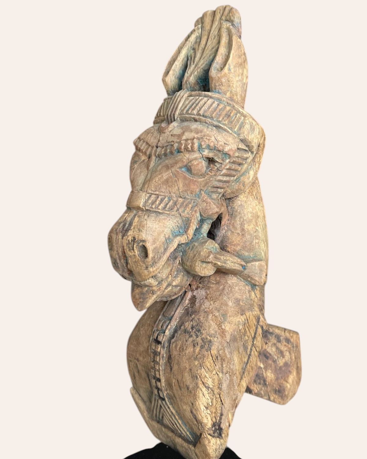 hand-carved wooden horse bracket on iron stand