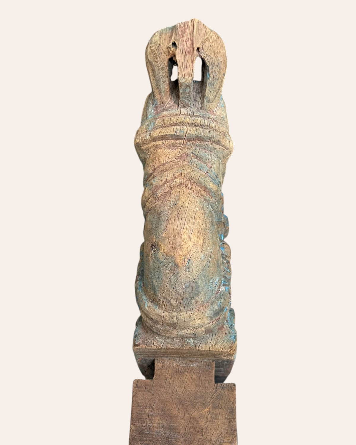 vintage distressed hand-carved wooden horse on iron stand