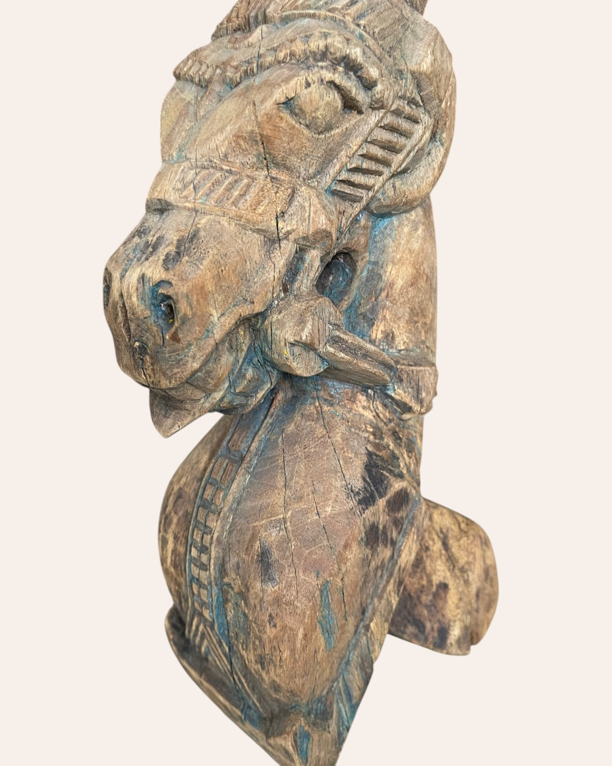 vintage distressed hand-carved wooden horse bracket on iron stand