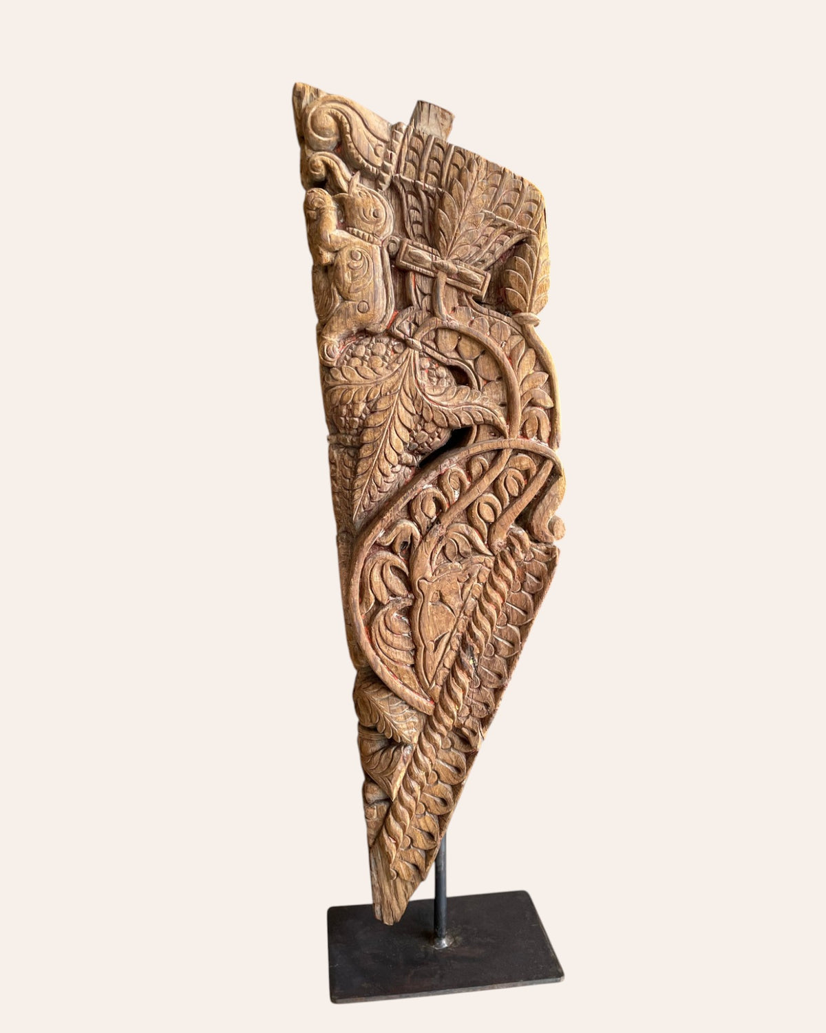 vintage hand-carved yali sculpture on iron stand